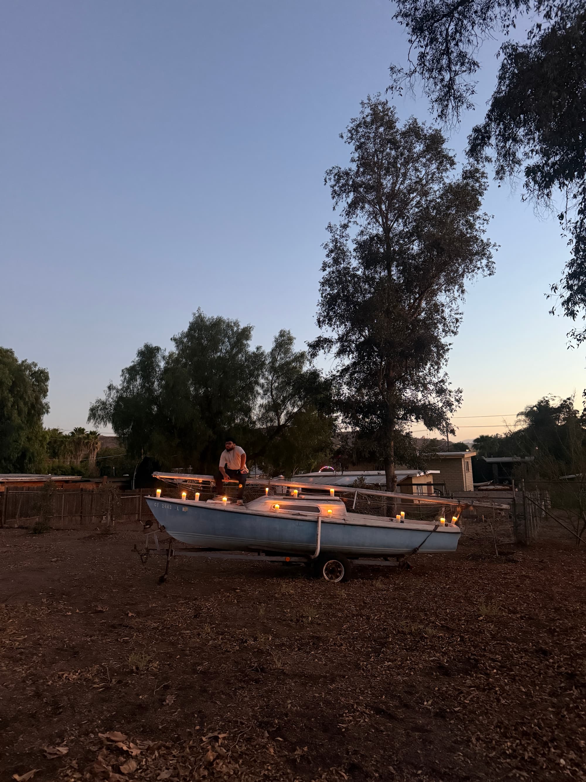 Sailboat at dusk with candles